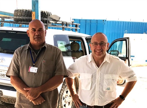 Security Consultants in the field conducting a security risk assesment. 