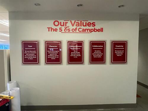 Multi-level acrylic displays with corporate messaging. CNC cut dimensional lettering painted to match corporate colors. 