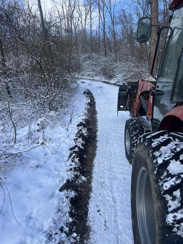 Recent driveway plowed and the crown taken out. 