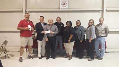 SLHBA Board presenting the Haven with a donation.