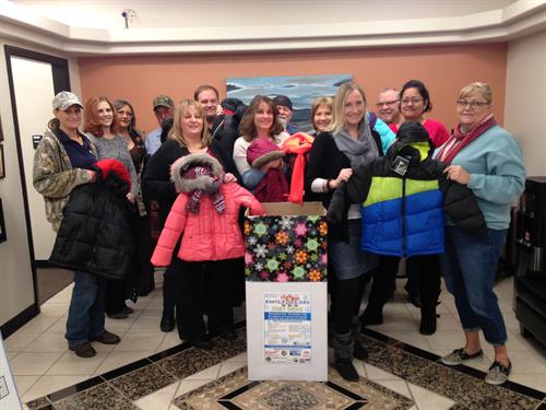 Presenting coats for Koats for Kids to United Way.