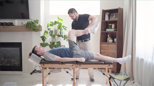 Testing a quad muscle on a patient at home