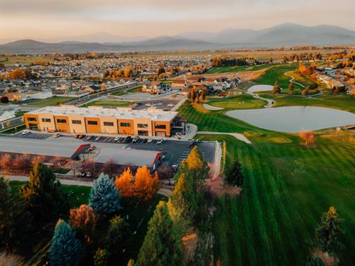 Aerial view of south side of the Club building with golf course on the right.