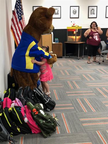 Baxter gave out 20 back packs filled with schools supplies to EV Library Summer Reading Program graduates.