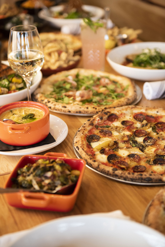 various pizzas and small plates