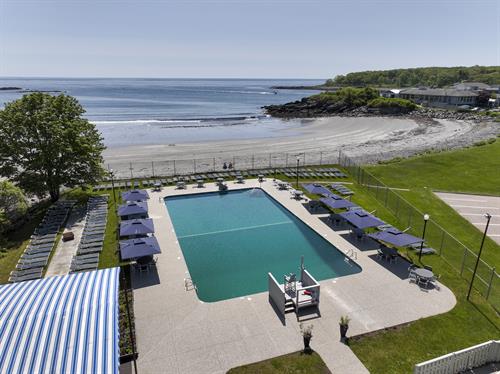 Our seasonal outdoor pool overlooks the Harbor Beach.