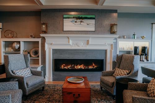 Enjoy sitting by the fire with your favorite drink.