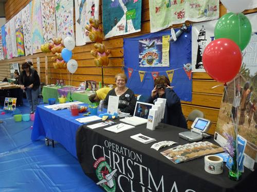 Promoting Lighthouse and Operation Christmas Child at the Family Fair.