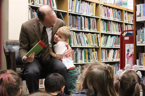 The Headmaster, Mr.Brand, reads to Junior Kindergarteners during book week