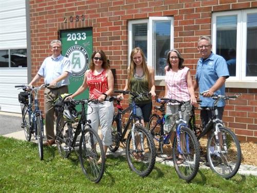 We love to bike, here is our office staff  who all rode there bikes to work