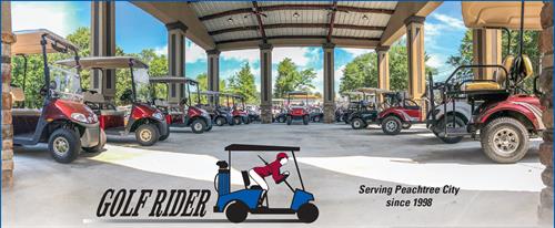 Gallery Image Pavilion_with_Red_E-Z-GO_Golf_Carts_and_Logo.jpeg