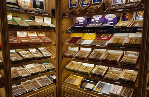 Our 120 SF custom humidor holds over 130 different types of Cigars. 