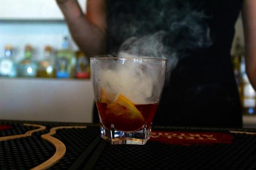 Enjoy your cocktail smoked and over a hand-crafted ice ball