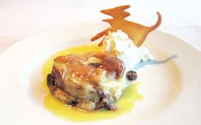 Bread pudding with dried cherries and chocolate chips with beurre blanc sauce