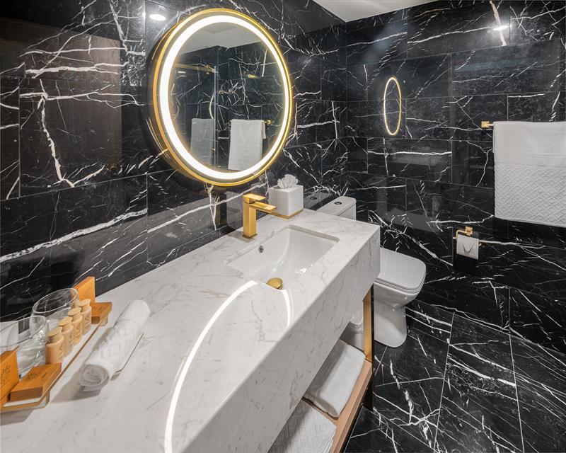 Wall to ceiling marble bathrooms