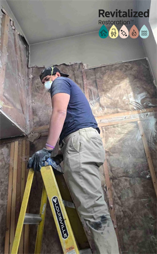 Technician on site, working safely and efficiently to restore every detail.