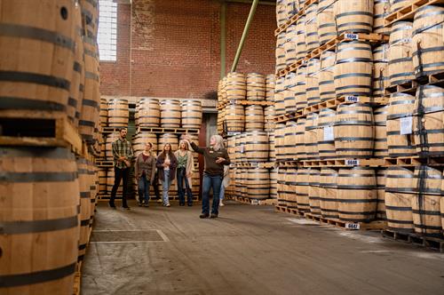 Gallery Image Tour_Group_and_Stacks_of_Barrels.jpg