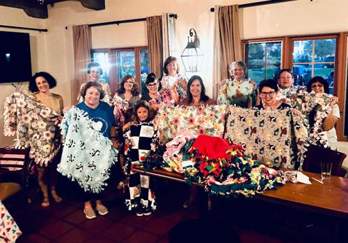 Woman's Club of Vista with blankets made for Vista Community Clinic newborns