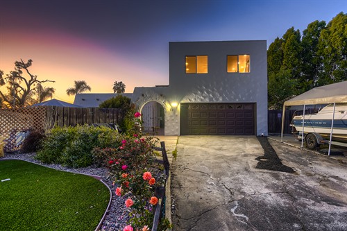 A custom second-story studio ADU designed primarily over an existing garage to create independent living space on a property with limited room for a ground-floor addition.