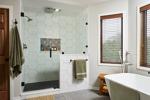 Bathroom with free-standing tub, low clearance threshold shower