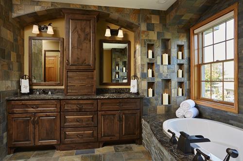 Master bath with extensive and creative use of stone tile throughout with heating floors.