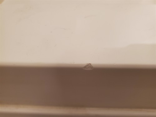 Chipped shower threshold.