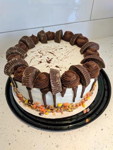 Peanut Butter Chocolate Ice Cream Cake with a Peanut Butter Chocolate Ganache in the Middle