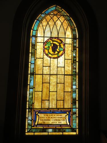 Window showing grapes, one of the two elements of Holy Communion