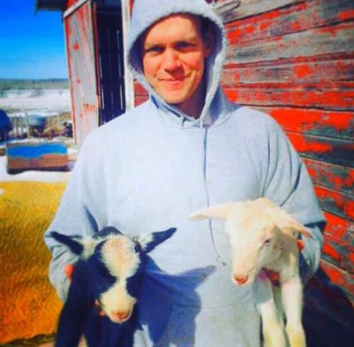 Fred Faye of Happy Hollow Creamery in Bayfield, WI is showing off some sweet young goats. Fred Faye of Happy Hollow Creamery in Bayfield, WI is showing off some sweet young goats.