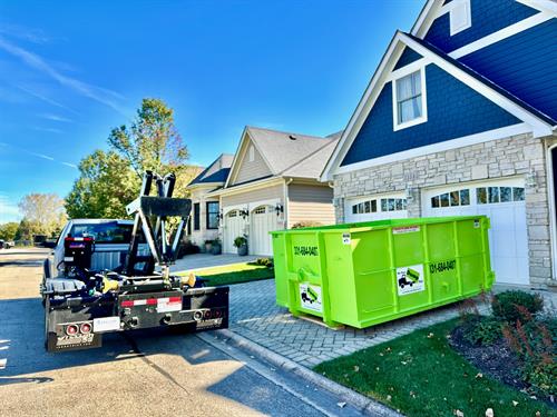 Residential friendly dumpster size, with driveway protection system.