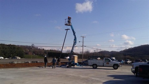 Gallery Image Heltons_Installing_Parking_Lot_Lights.jpg