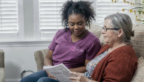 caregiver reading with senior