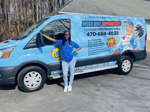 Ashleigh, owner of Dryer Vent Superheroes of DeKalb County, pictured with our trusted service vehicle, ready to keep homes safe and efficient.