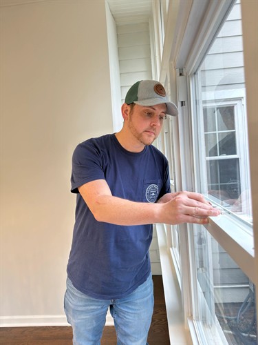 Inspecting window locking mechanisms during a home inspection
