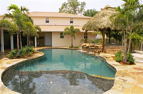 Lagoon style pool with Flagstone Patio, Coping and Waterfall. 