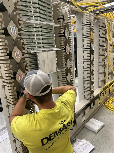 Demarc Telecom tech working in a data center located in Wakefield Ma 