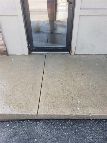Restaurant entry after pressure washing for grease removal