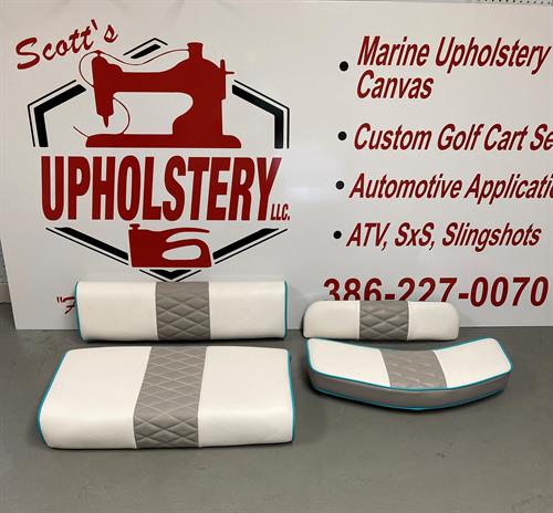 4 boat cushions with logo on sign
