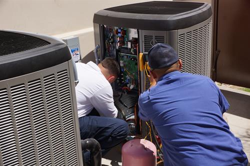 Our Technicinas working hard to maintain our customes HVAC equipment.