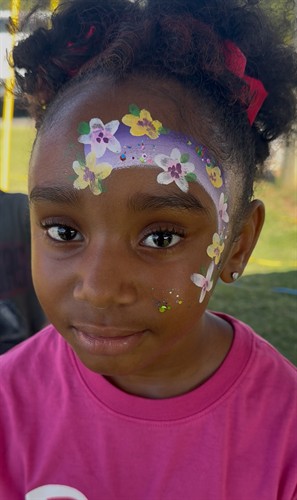 girl with flowers face paint