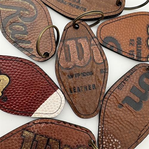Gallery Image Football_Leather_Keychains_(double-sided)_-_Hide_Park_Apparel_-_WEAR_A_PIECE_OF_THE_GAME.jpg