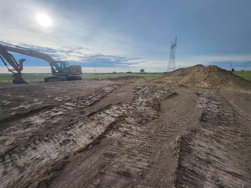 New home Dirt Prep 300x550 Sq. Ft. & 750 Tons of Dirt brought in. Leveled, and graded for the foundation