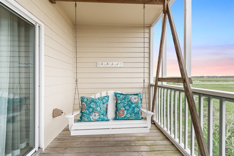 Bird Island Room, top floor corner porch with rockers and porch swing