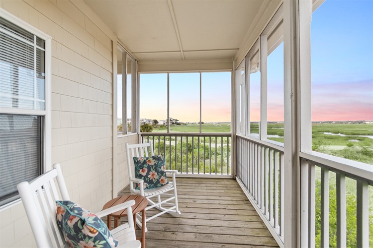 Hatteras Room, top floor corner porch with rockers and porch swing
