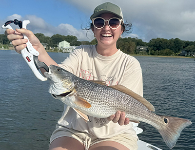 23 inch Red Drum caught near Shallotte Inlet in OIB with Salty Dawg Fishing Charters