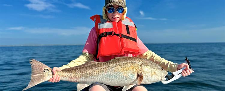 Bull Redfish caught on an Ocean Isle Beach Kids Fishing Charter with Salty Dawg Fishing Charters