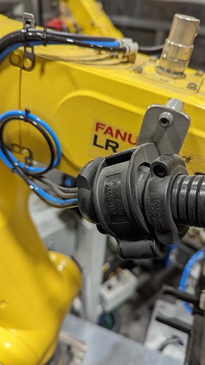 Industrial GE Fanuc robot retrofit with flexible cable management dressing