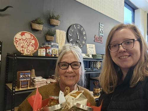 Victoria buying a client gift basket at Crimson and Clover in Hastings