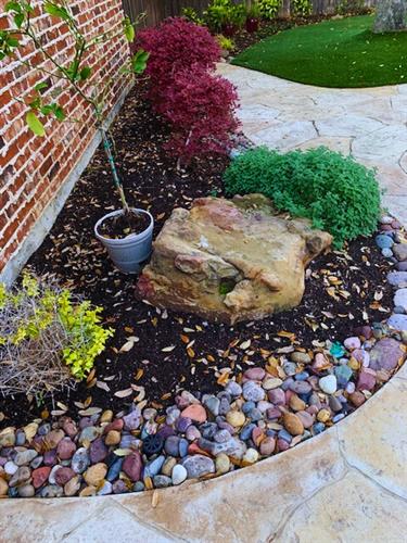 River rock design for flower beds