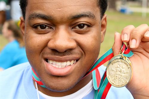 Gallery Image Athlete_Smiles_With_Medal.jpg